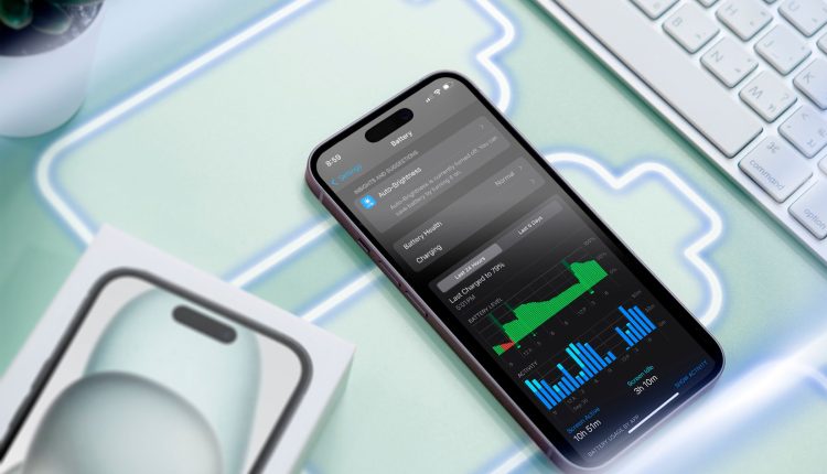 An iphone on a surface with some battery icons and the screen showing battery usage.jpg