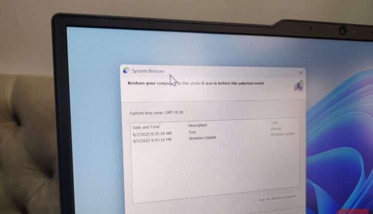 Close up of laptop showing system restore window.jpg