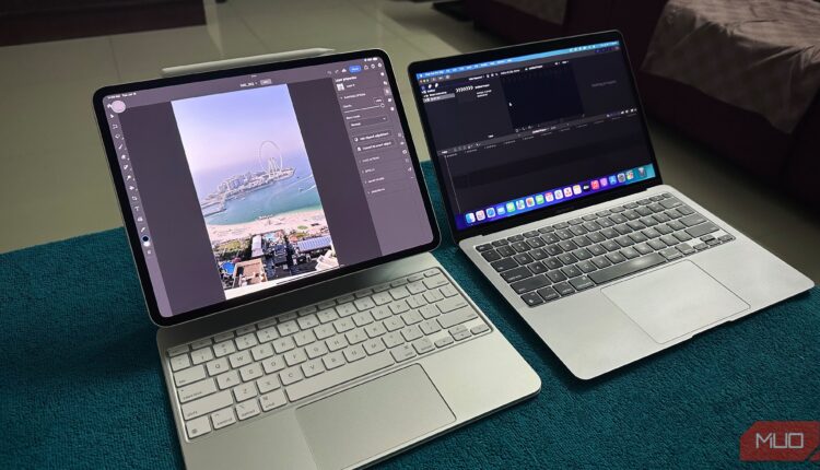 An ipad pro running photoshop next to a macbook running final cut pro on a desk.jpg