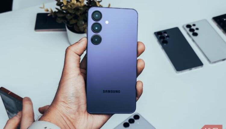 Samsung galaxy s25 in navy in hand.jpg