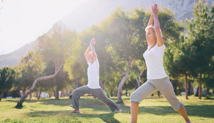 Yoga couple mature senior healthy sport park 1200x630.jpg