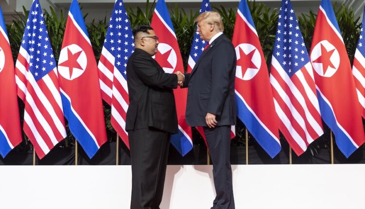 Kim and trump shaking hands at the red carpet during the dprk–usa singapore summit.jpg