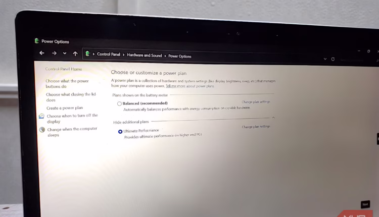 A laptop screen showing the windows power options control panel with the ultimate performance plan a.avif