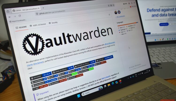 Vaultwarden github on laptop screen bitwarden background.jpg