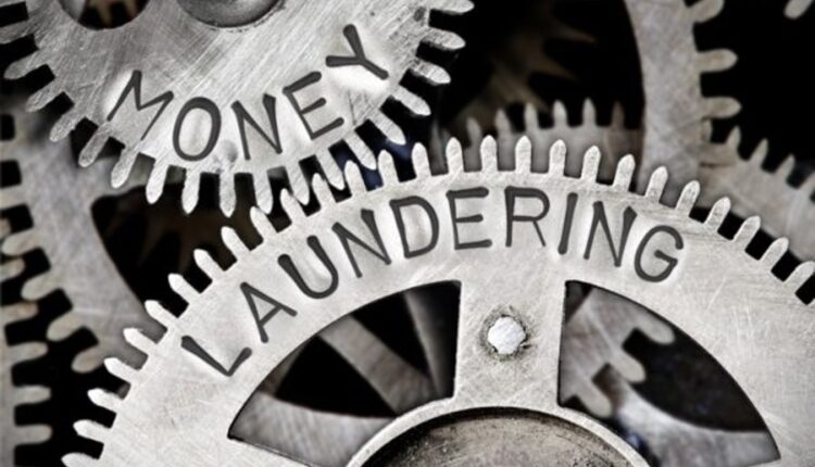 Money laundering resized silver gears 07.22.26 Getty.jpg