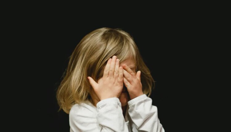 Girl covering her face.jpg