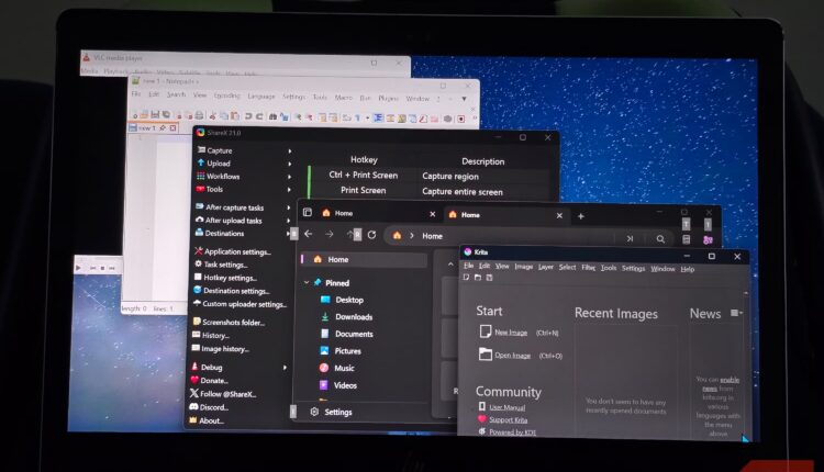 Laptop screen showing multiple open application windows.jpg